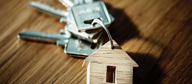 keys with a wooden key-chain with a house shape