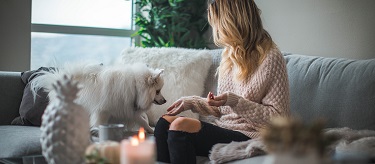 Woman sitting with dog